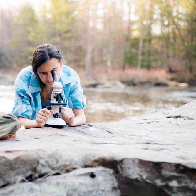 Woman testing water quality outdoors