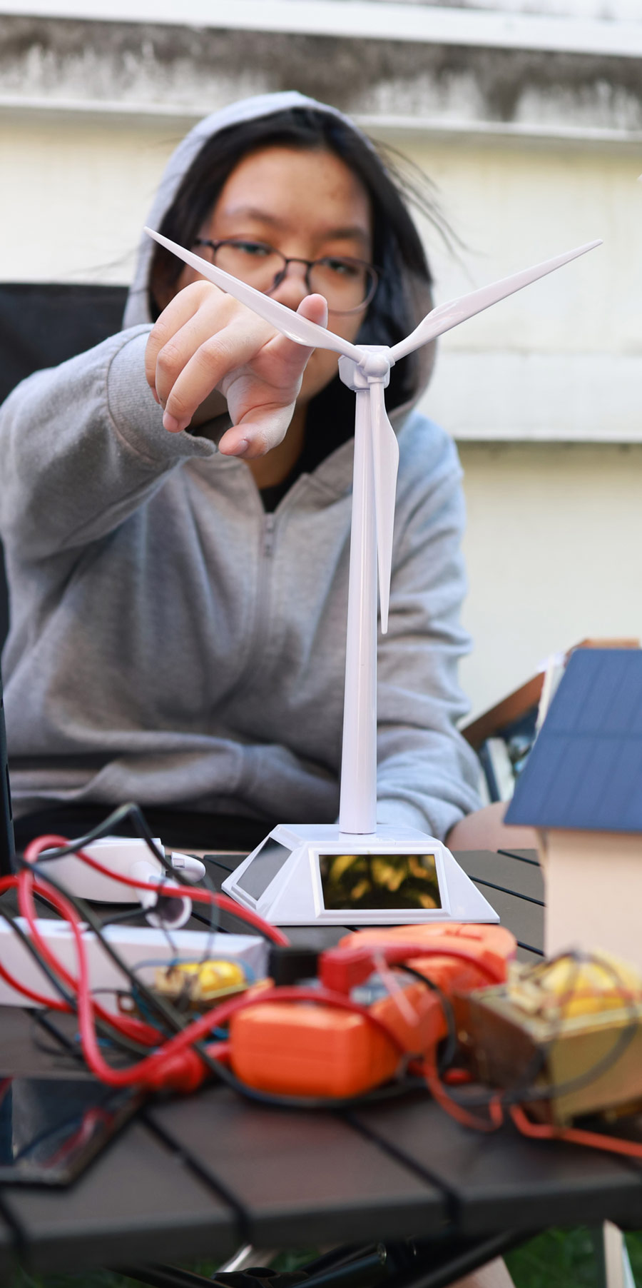 Student working with wind turbine model